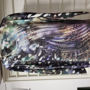 Chico's sizing two. Beautiful multicolored tunic length pullover shirt.